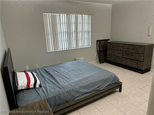 bedroom featuring tile patterned floors