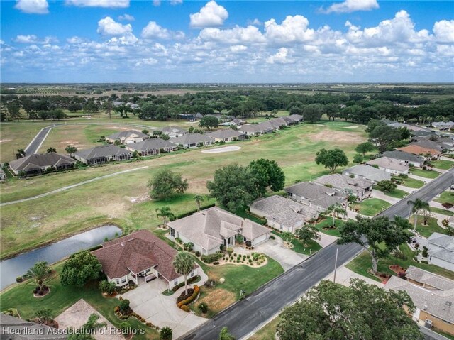 birds eye view of property featuring a residential view and a water view