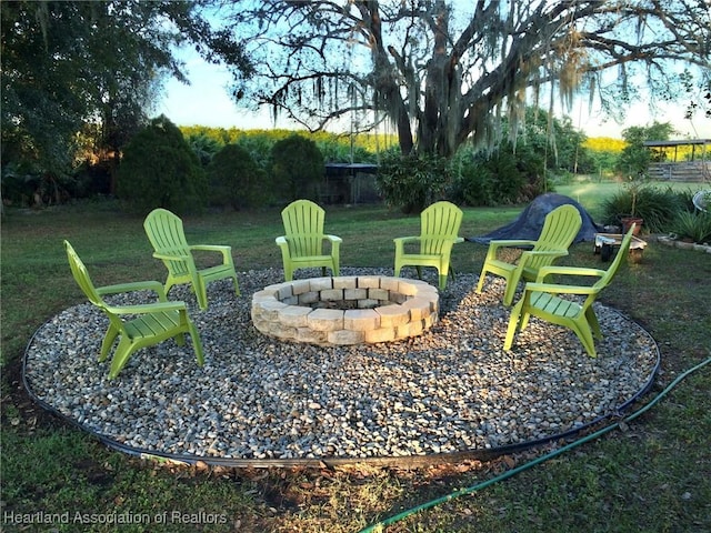 view of yard with an outdoor fire pit