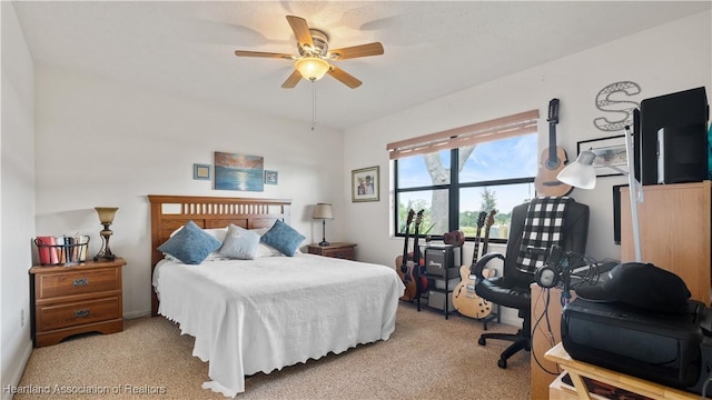 bedroom featuring light carpet and ceiling fan