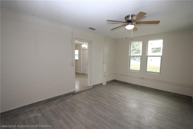 unfurnished room with ceiling fan and wood-type flooring