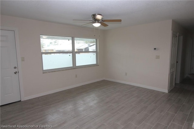 spare room with ceiling fan