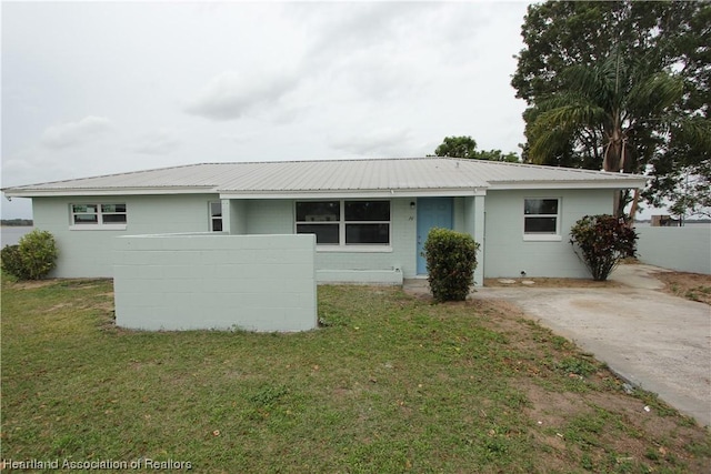 ranch-style house with a front yard