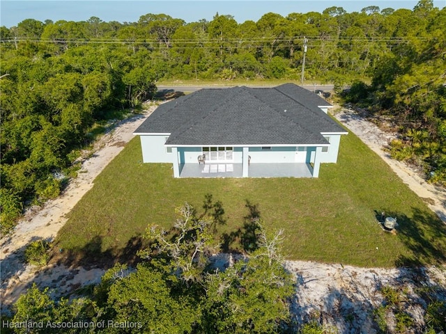 aerial view featuring a view of trees