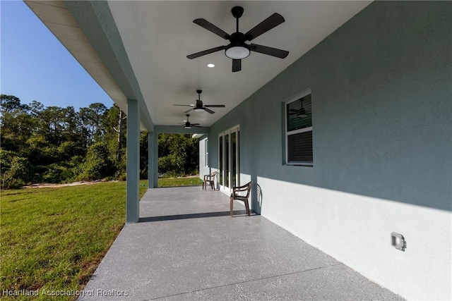 view of patio featuring ceiling fan