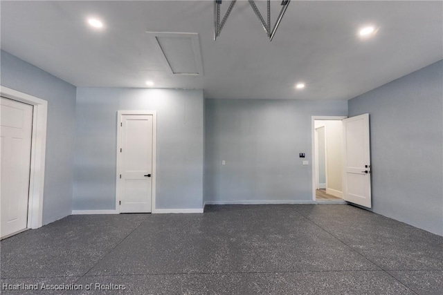 interior space featuring recessed lighting and baseboards