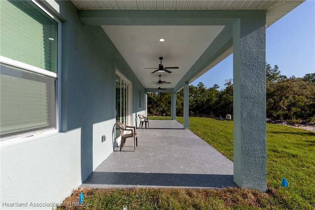view of patio featuring ceiling fan