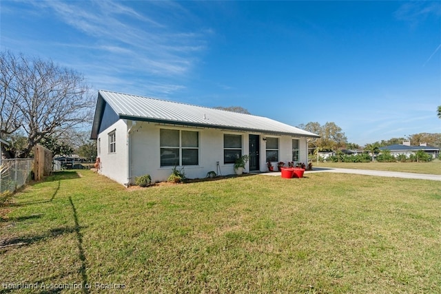 ranch-style house featuring a front lawn