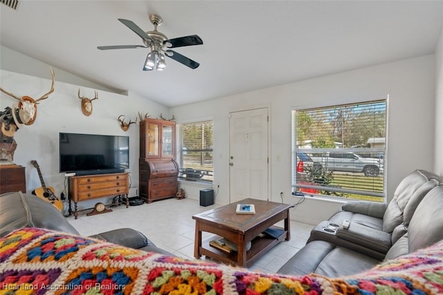 tiled living room featuring lofted ceiling and ceiling fan