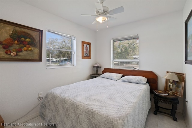 bedroom featuring light tile patterned flooring and ceiling fan