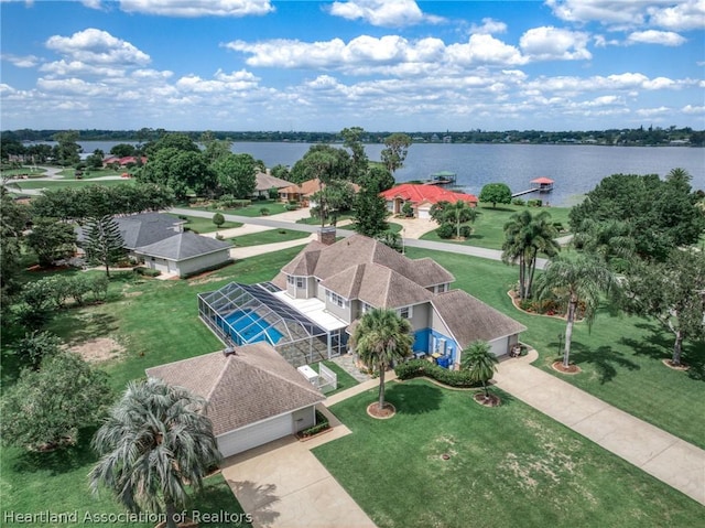 birds eye view of property with a water view