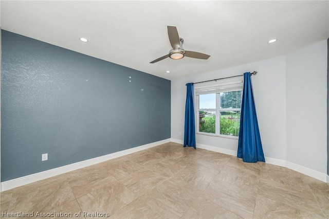 unfurnished room featuring ceiling fan