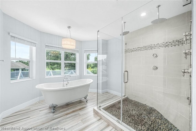 bathroom with separate shower and tub