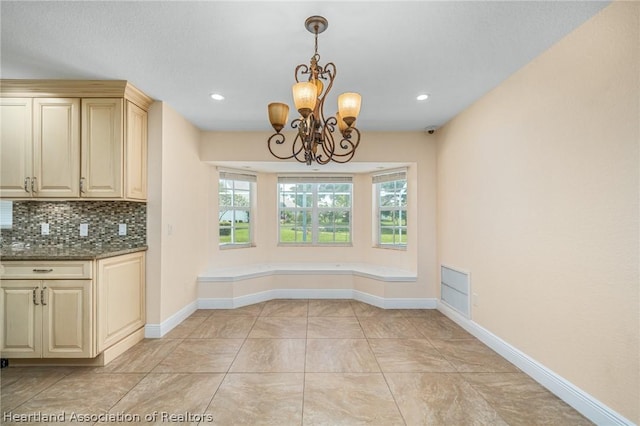 unfurnished dining area featuring light tile patterned floors and an inviting chandelier