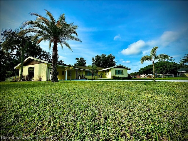 ranch-style home with a front yard