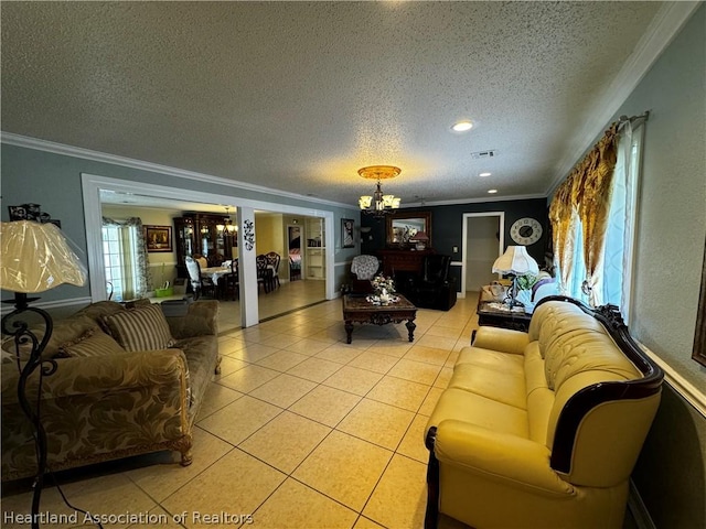 living room with a notable chandelier, light tile patterned flooring, ornamental molding, and a textured ceiling