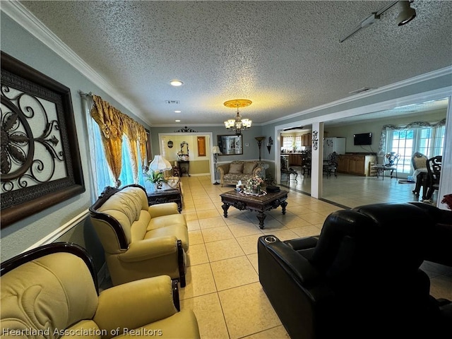 living room with a textured ceiling, light tile patterned floors, crown molding, and a chandelier