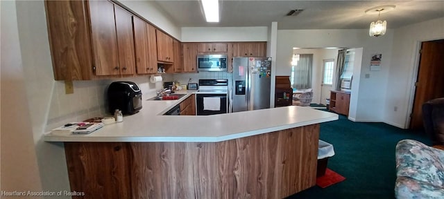 kitchen featuring stainless steel appliances, light countertops, visible vents, and tasteful backsplash