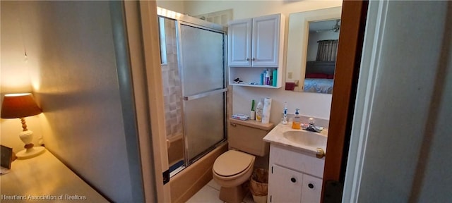 full bathroom with toilet, bath / shower combo with glass door, and vanity