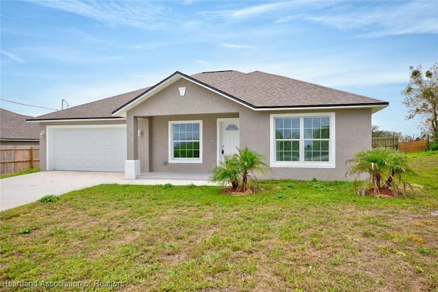 ranch-style home featuring a garage and a front lawn