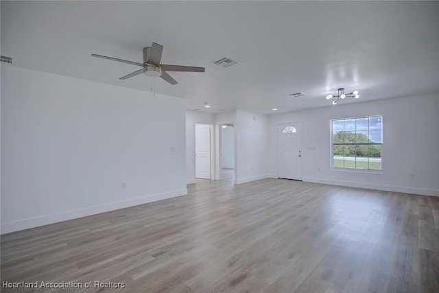 spare room featuring ceiling fan and light hardwood / wood-style floors