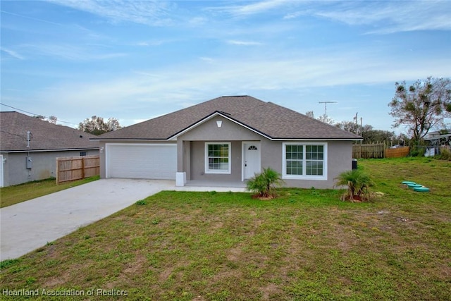 single story home featuring a porch, a garage, and a front yard