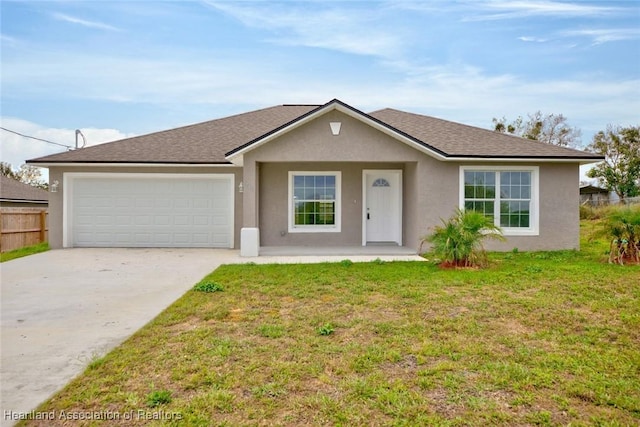 ranch-style house featuring a garage and a front lawn