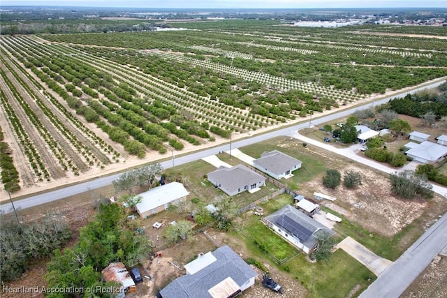 birds eye view of property with a rural view