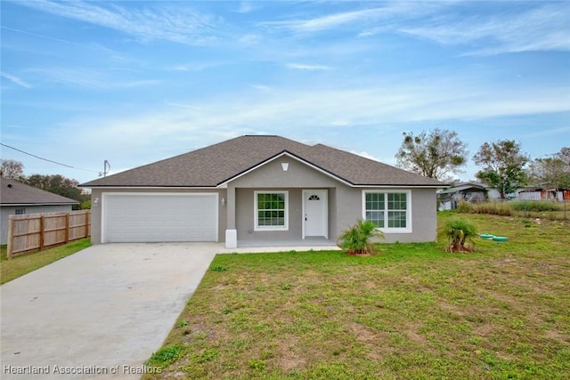 ranch-style house featuring a garage and a front lawn