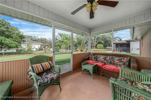 sunroom featuring plenty of natural light and ceiling fan