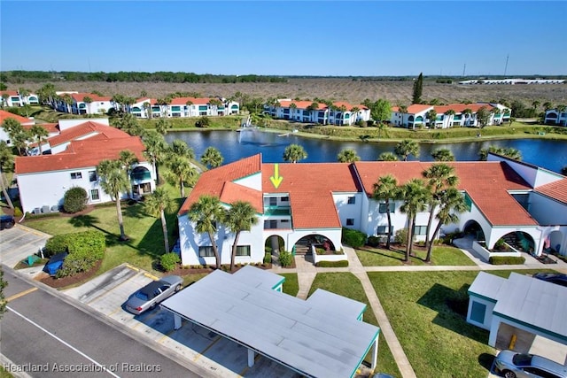 bird's eye view featuring a residential view and a water view