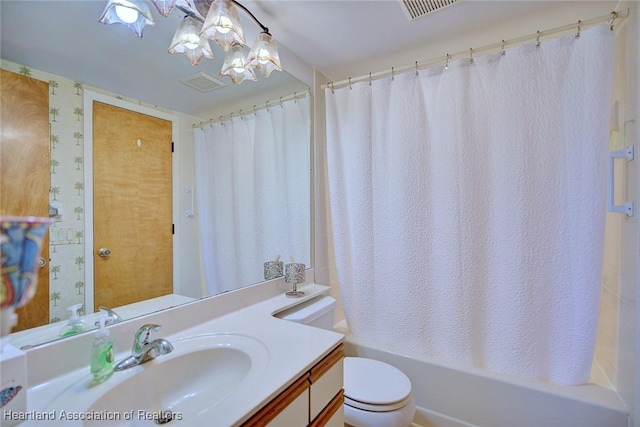 bathroom with visible vents, shower / tub combo, toilet, and vanity