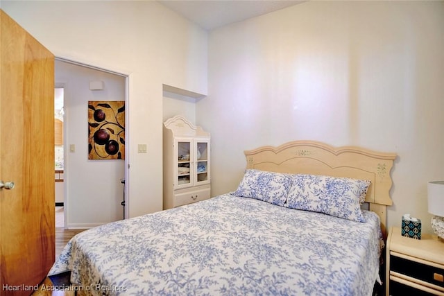 bedroom with wood finished floors