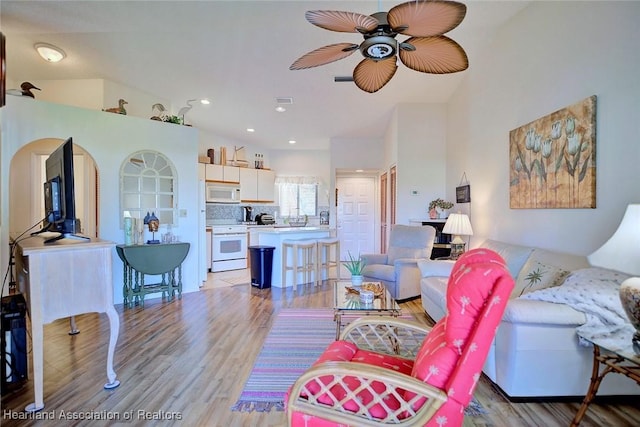 living area featuring visible vents, recessed lighting, light wood-type flooring, and ceiling fan