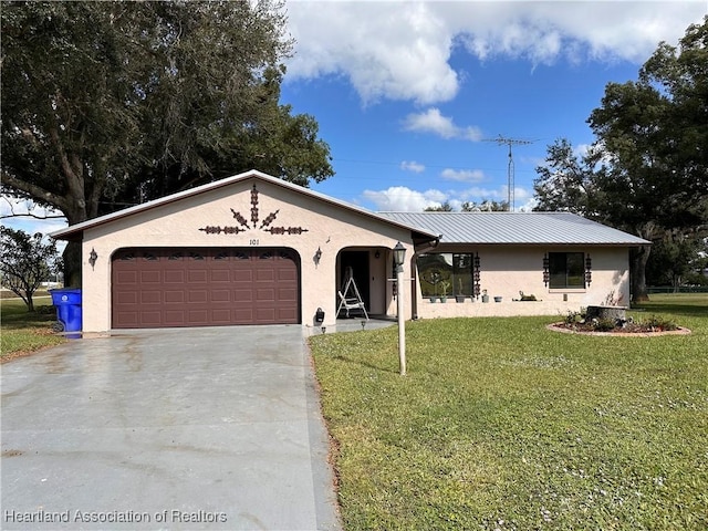 ranch-style house featuring a garage and a front yard