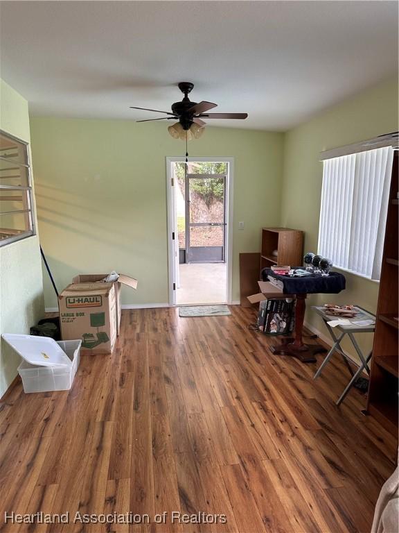 interior space featuring ceiling fan and wood-type flooring