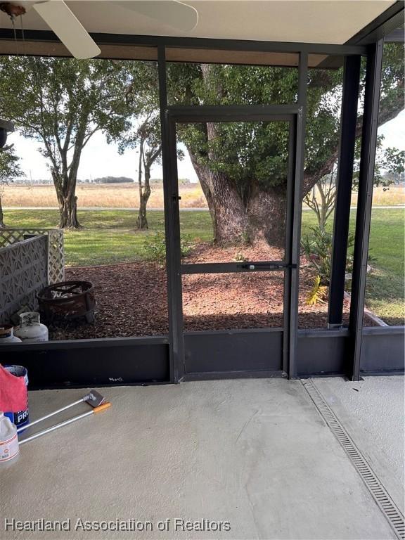 entryway featuring concrete floors and a rural view