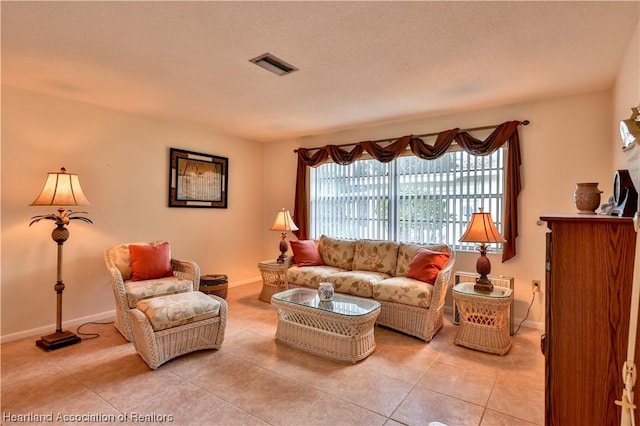 living room with light tile patterned flooring