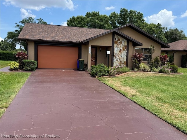 2914 Summertree Dr, Sebring, FL 33872 - view of front of home featuring stucco siding, a garage, asphalt driveway, a front yard, and stone siding