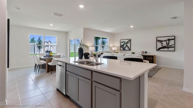 6830 Coconut Dr, Sebring, FL 33782 - kitchen featuring a sink, stainless steel dishwasher, gray cabinets, open floor plan, and light countertops