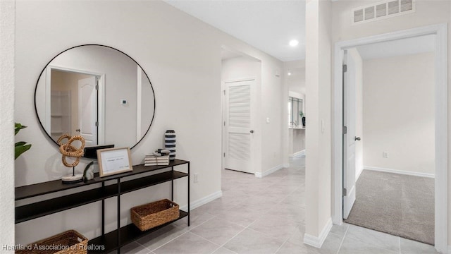 6830 Coconut Dr, Sebring, FL 33782 - corridor featuring light tile patterned floors, baseboards, and recessed lighting