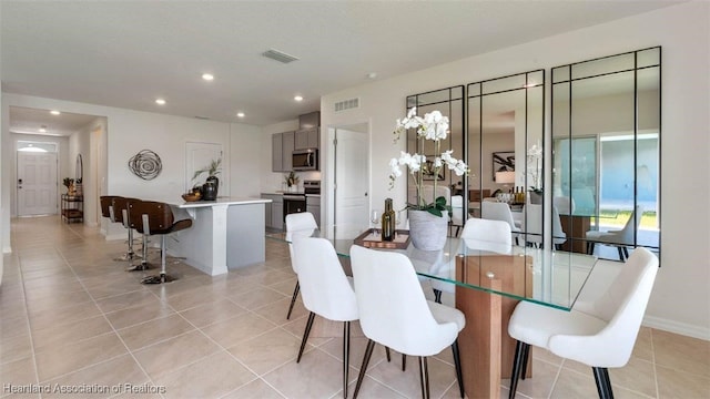 6830 Coconut Dr, Sebring, FL 33782 - dining space with light tile patterned floors, recessed lighting, and baseboards