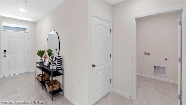 6830 Coconut Dr, Sebring, FL 33782 - entryway with light tile patterned floors and baseboards