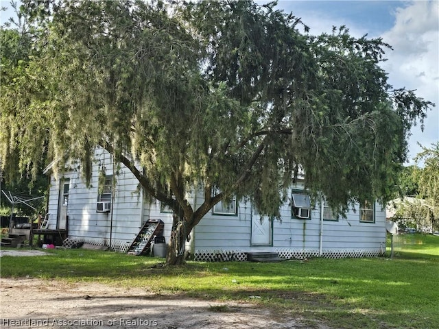 view of home's exterior featuring a lawn