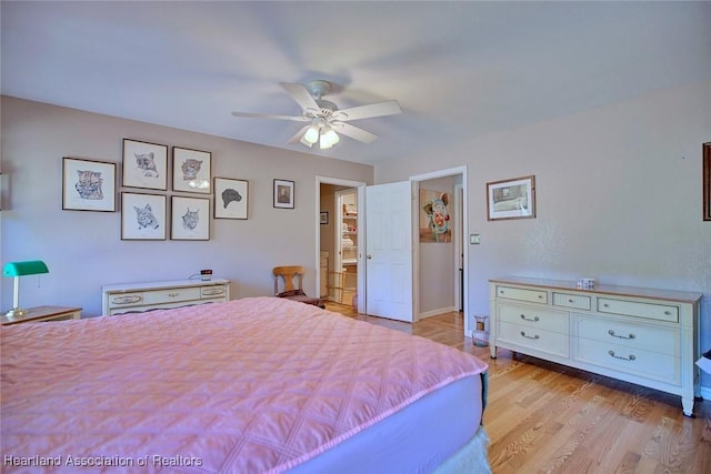 bedroom featuring light wood finished floors and a ceiling fan