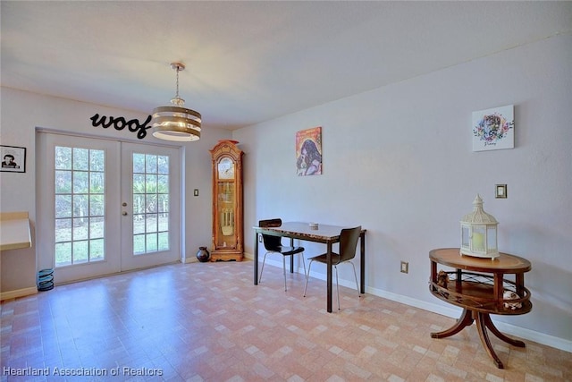 interior space with french doors and baseboards