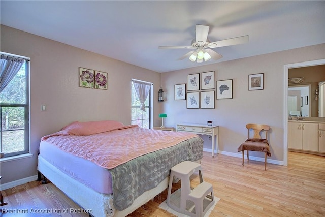 bedroom featuring baseboards, ceiling fan, and light wood finished floors