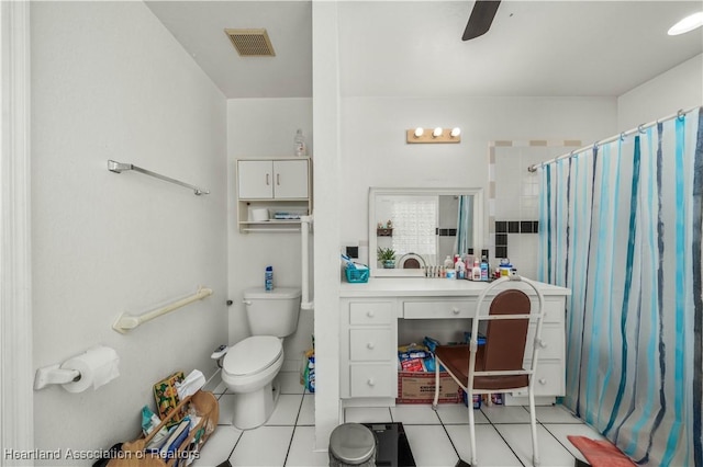 bathroom with toilet, vanity, curtained shower, ceiling fan, and tile patterned flooring