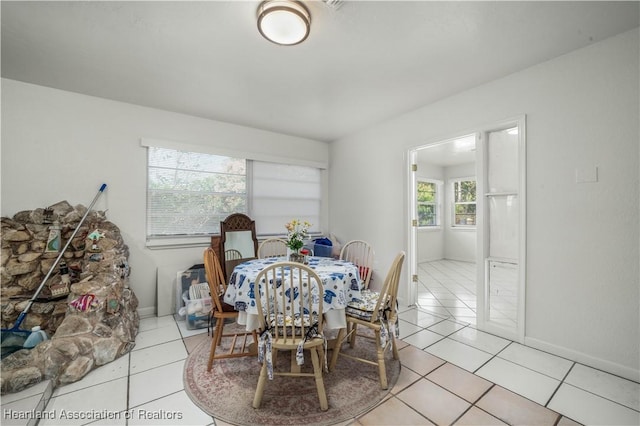 dining space with light tile patterned floors