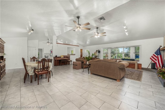 tiled living room with ceiling fan and lofted ceiling